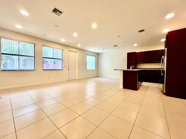 a view of kitchen with furniture and wooden floor