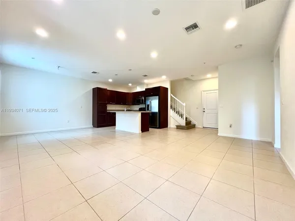 a view of kitchen with furniture and cabinets