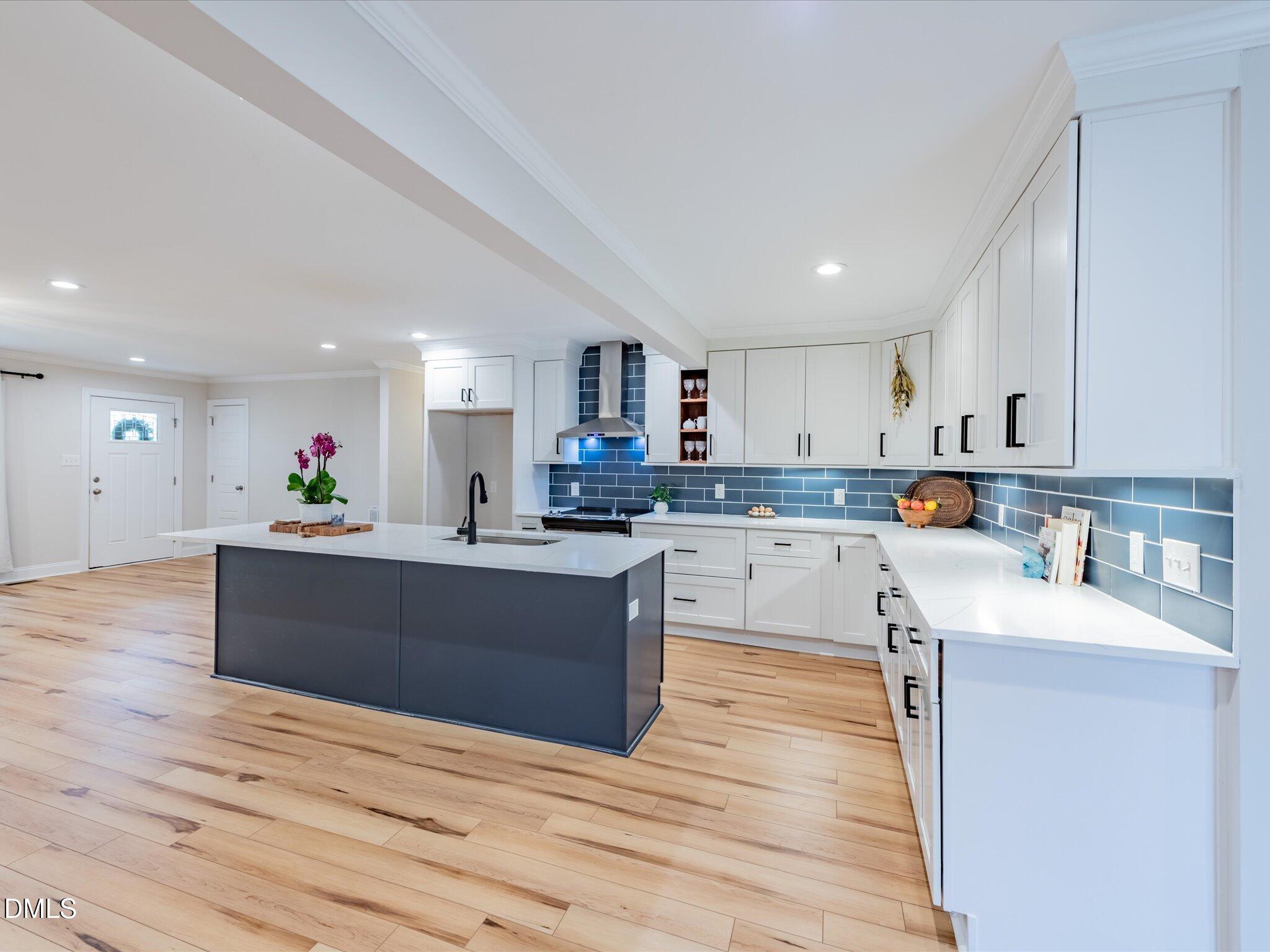 3320 High Gate Road Raleigh, NC 27603 - Photo 11 of 38 Kitchen Island, Cabinets and Back Splash