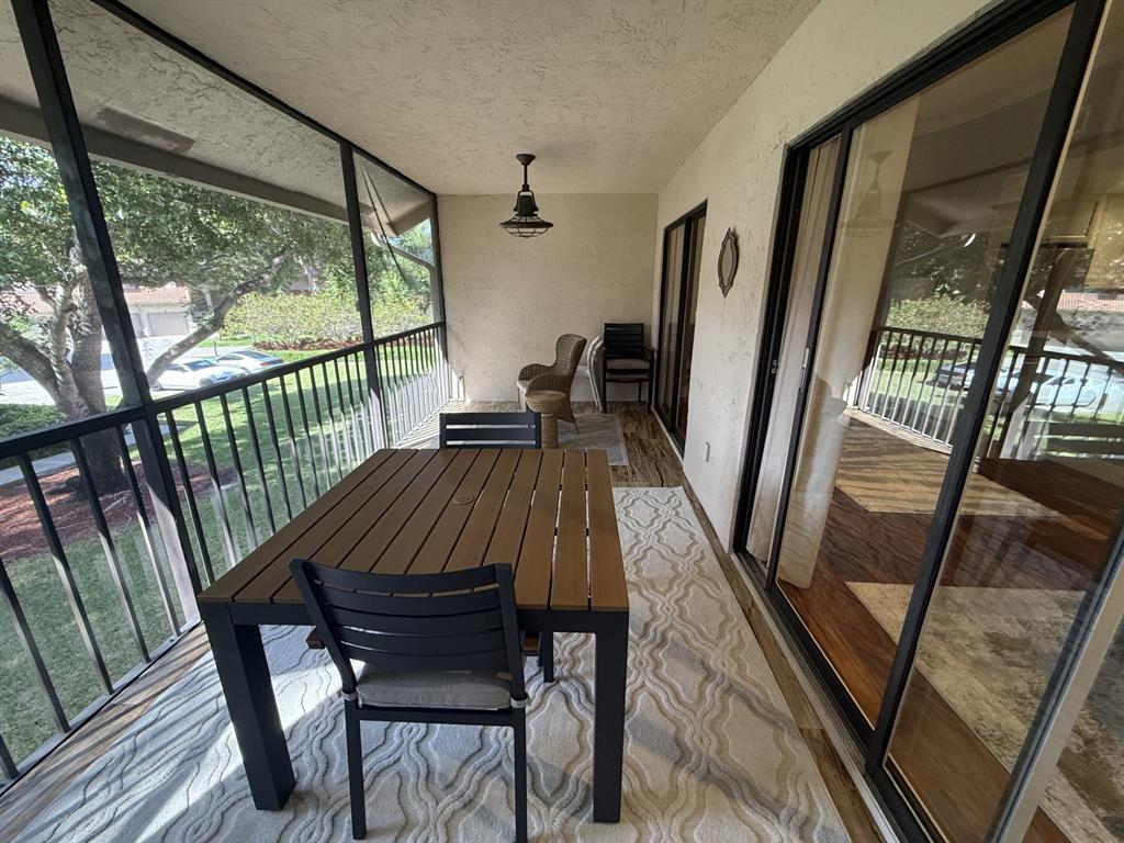 5560 Coach House Circle, Unit C Boca Raton, FL 33486 - Photo 29 of 31 a view of a chairs in balcony