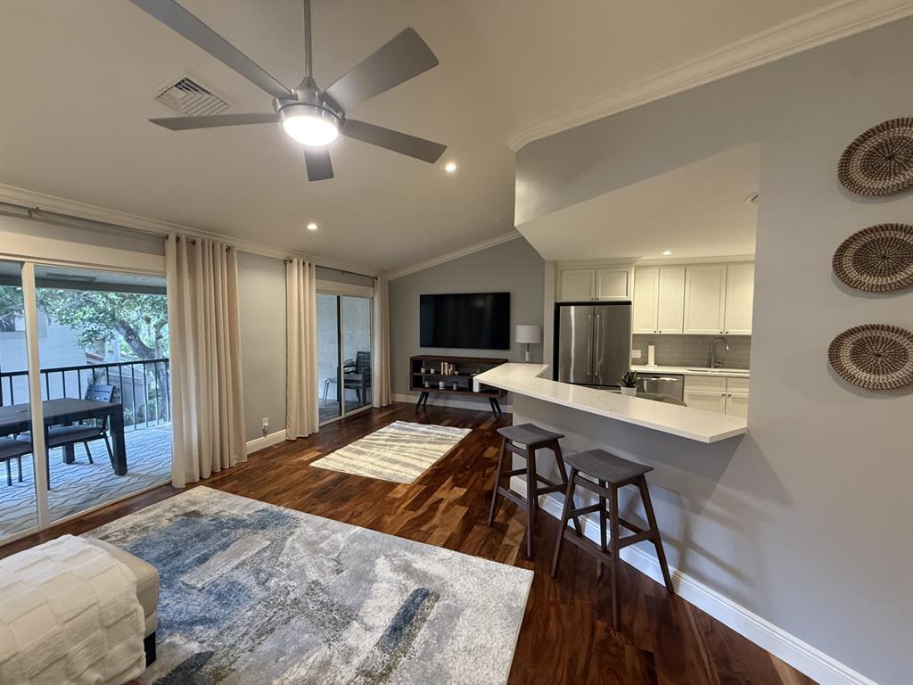 5560 Coach House Circle, Unit C Boca Raton, FL 33486 - Photo 7 of 31 a bed room with a bed a television and a large window