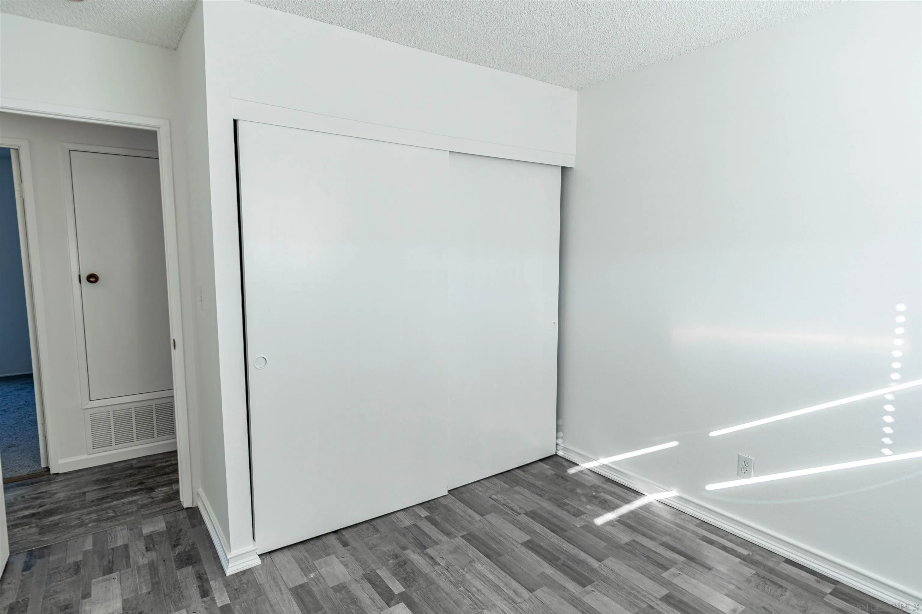 9431 Lake Canyon Road Santee, CA 92071 - Photo 20 of 35 a view of a small space with wooden floor and closet
