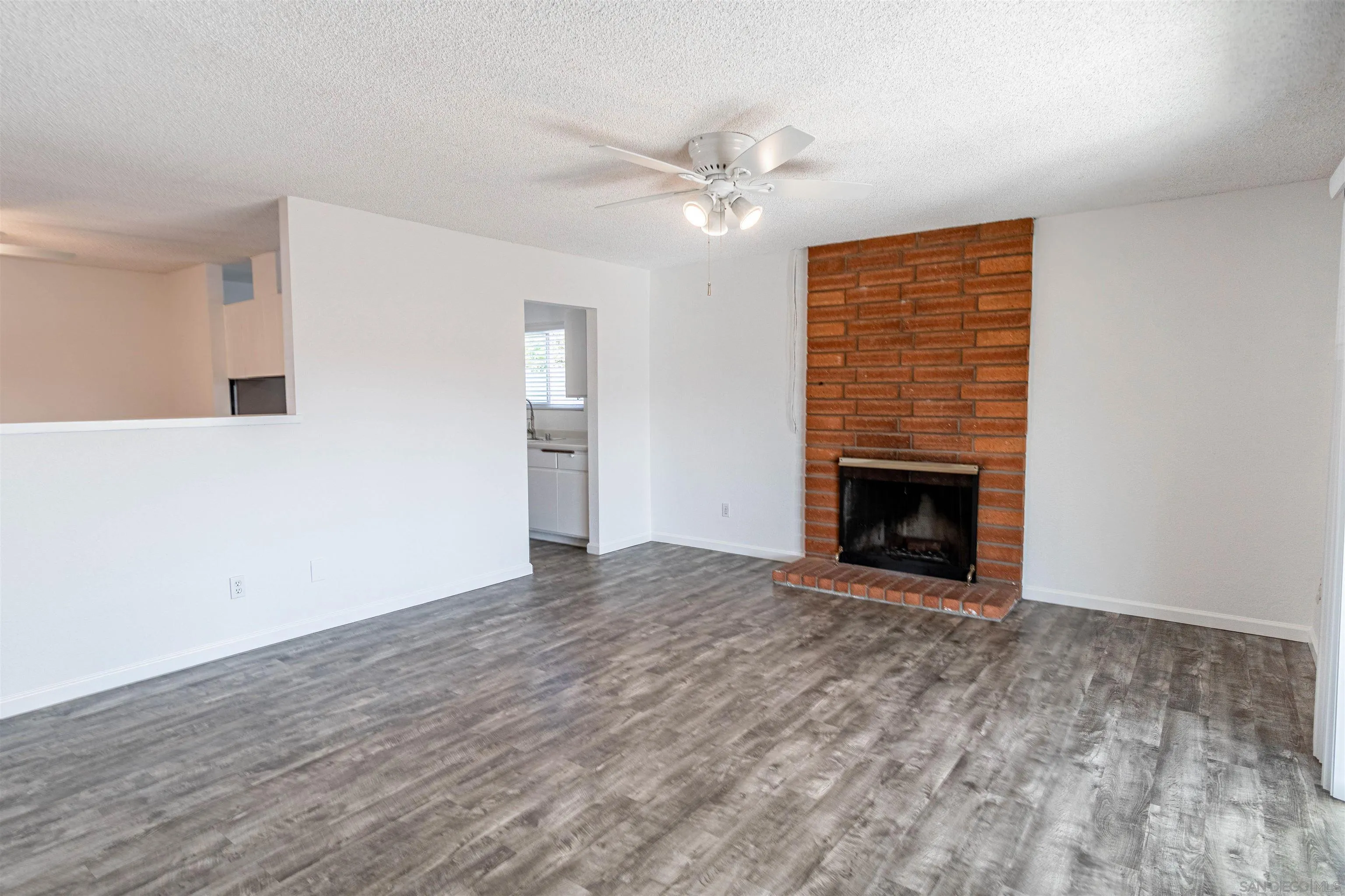 9431 Lake Canyon Road Santee, CA 92071 - Photo 10 of 35 a view of empty room with wooden floor and fan