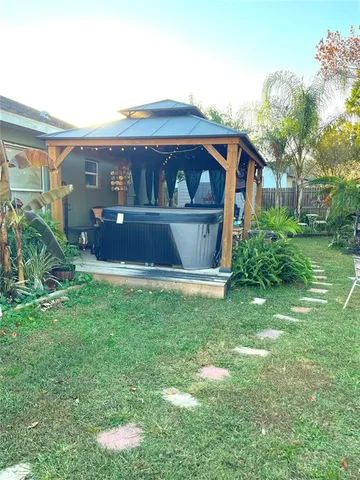 a front view of house with yard and trees