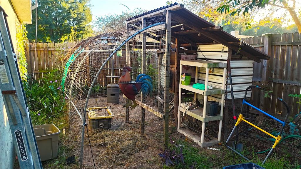 285 Northwest 65th Street Ocala, FL 34475 - Photo 15 of 18 a view of a house with backyard and sitting area