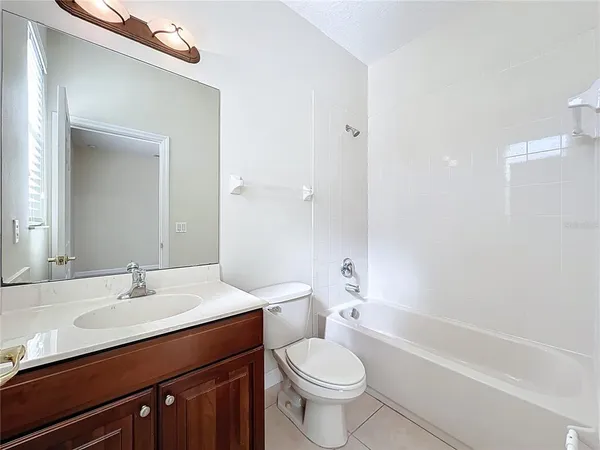 an empty room with wooden floor