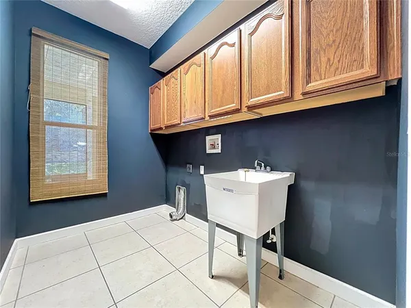 a view of a house with a yard and sitting area