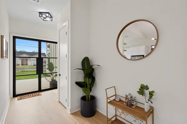 a bedroom that has a bed and a table in it