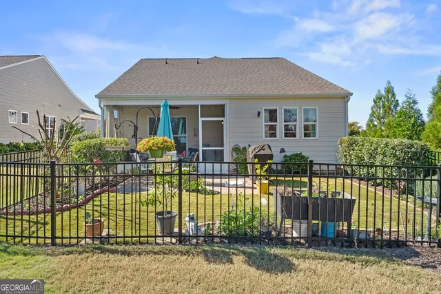 an aerial view of a house with a tree