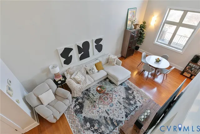 a bedroom with a bed and a flat screen tv on the dresser