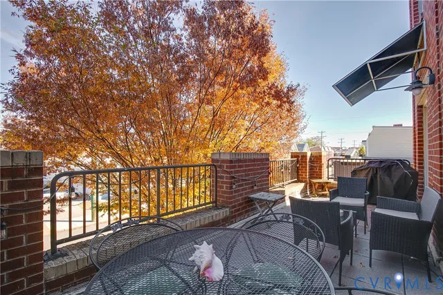a view of terrace with seating space and building view