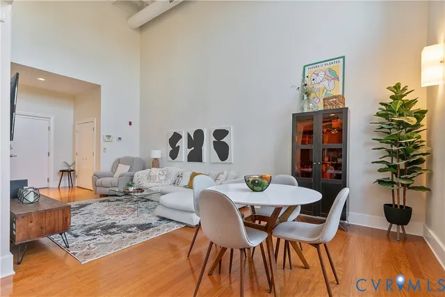a view of a dining room with furniture and wooden floor