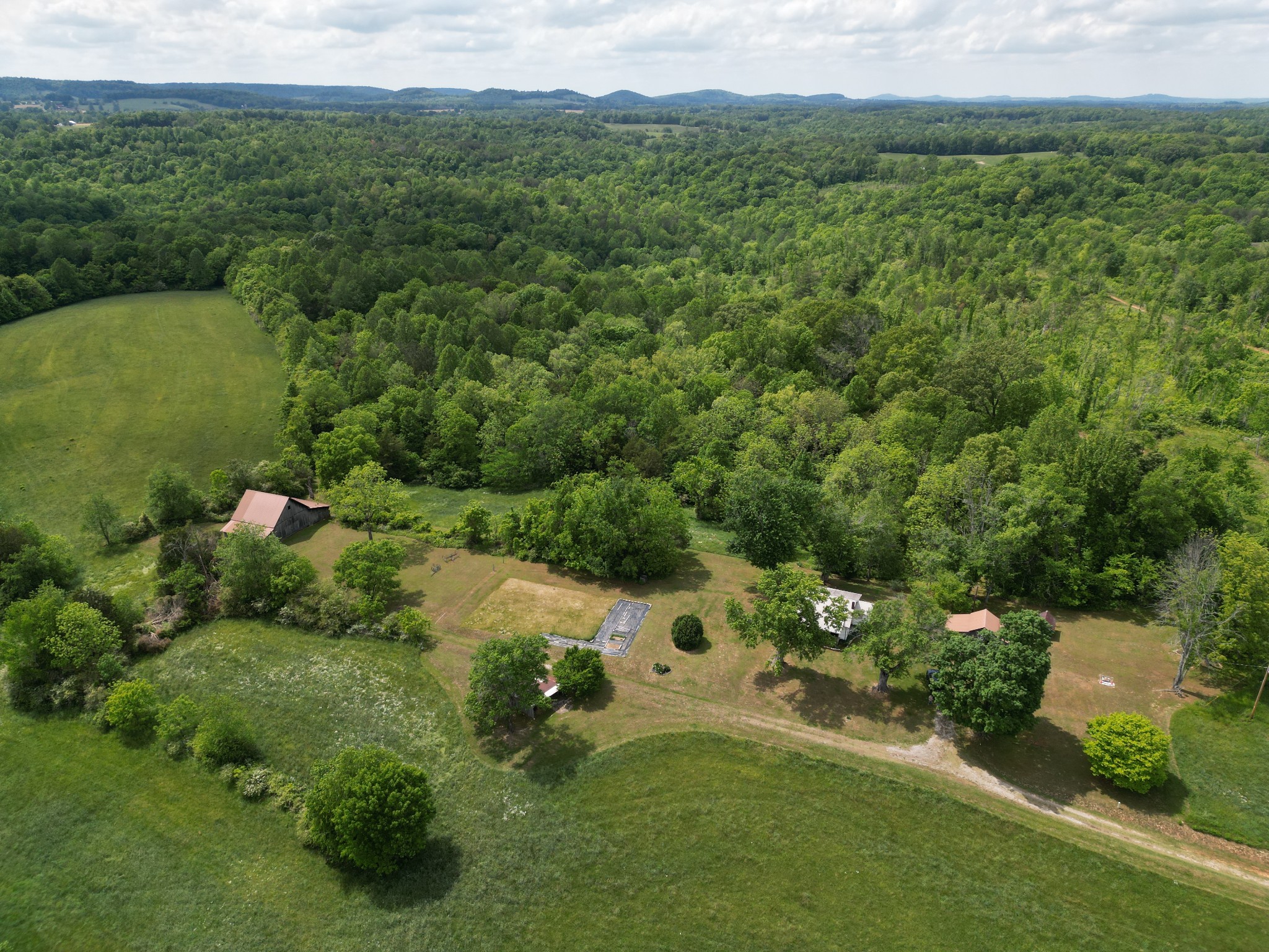 335 Nelson Cemetery Road Monroe, TN 38573 - Photo 28 of 81 an aerial view of a house with a yard
