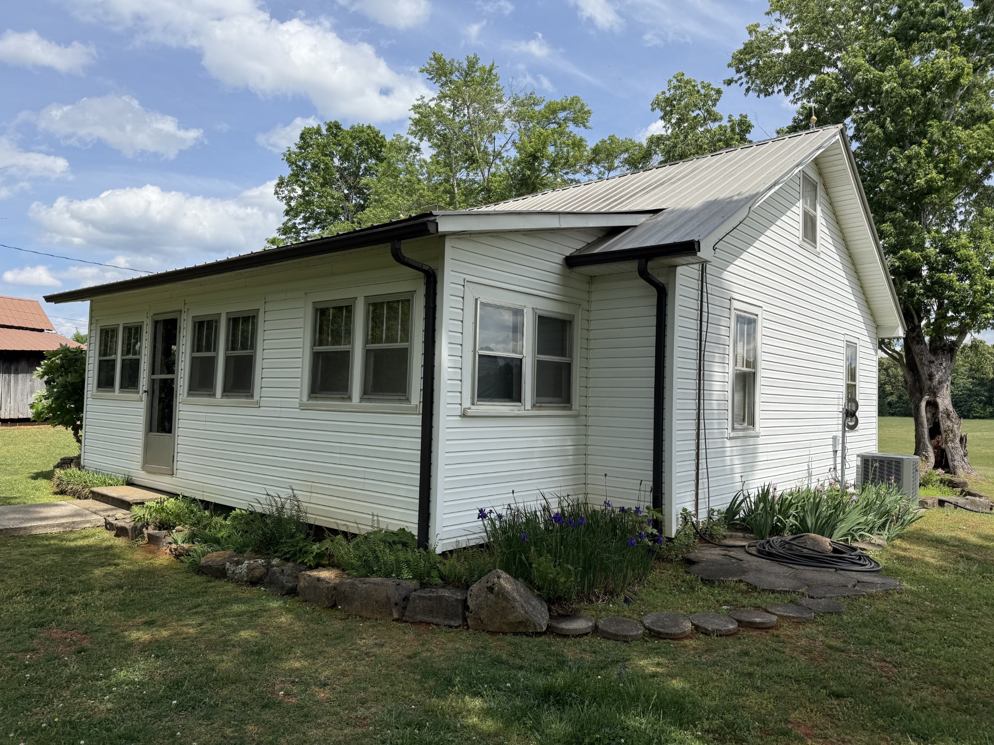 335 Nelson Cemetery Road Monroe, TN 38573 - Photo 38 of 81 a front view of a house with garden