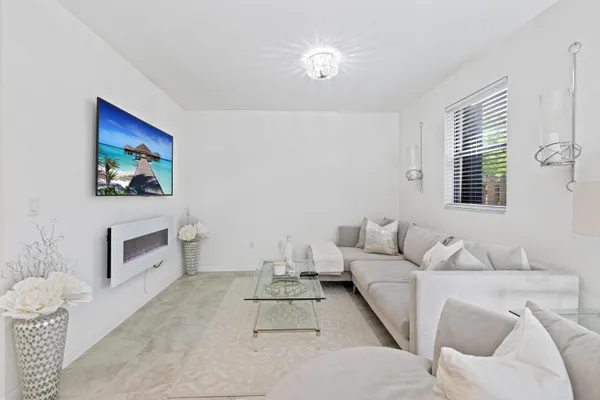 a living room with furniture and a window