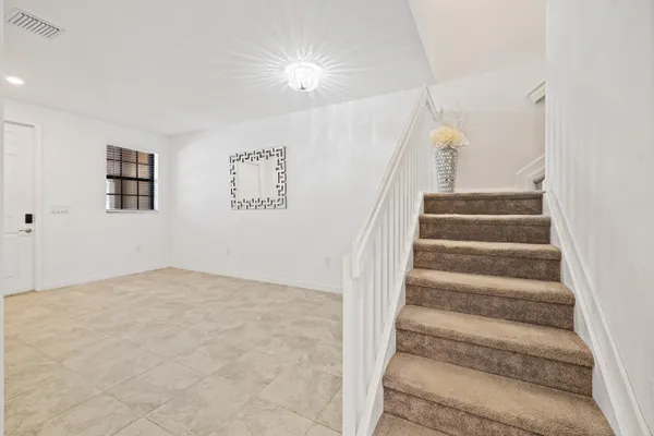 a view of an entryway with staircase