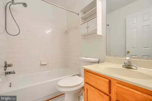 a bathroom with a sink a toilet and a bathtub