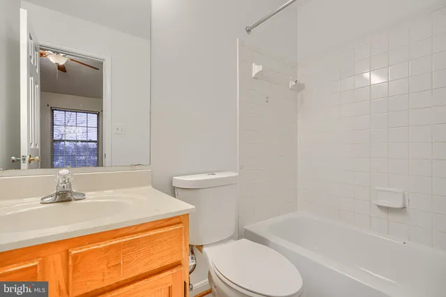a bathroom with a sink a toilet and bathtub