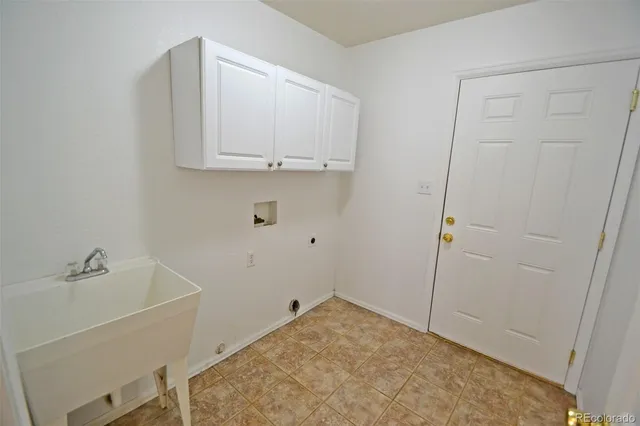 a bathroom with a sink and a washing machine