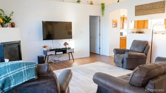 a living room with furniture and a large window