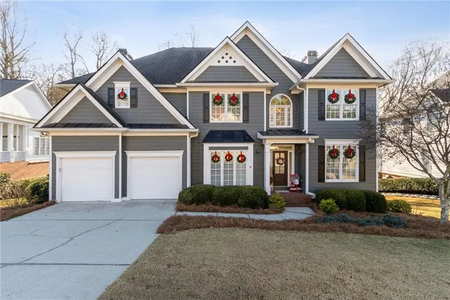 a front view of a house with garden