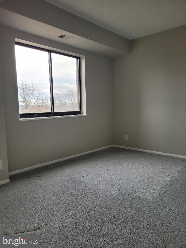 5903 Mt Eagle Drive, Unit 716 Alexandria, VA 22303 - Photo 2 of 9 an empty room with a window