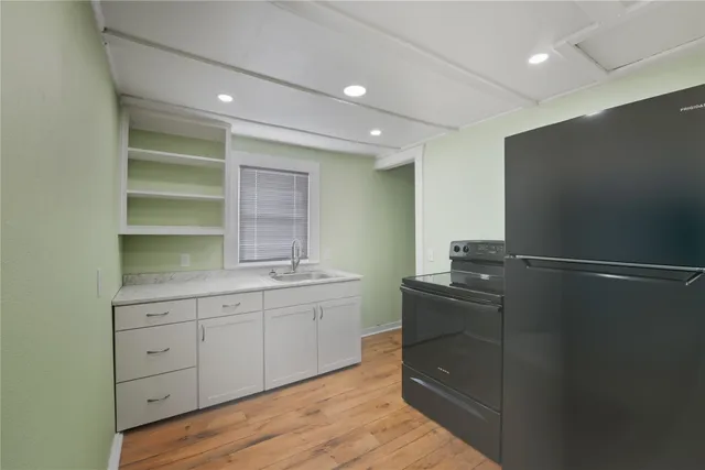 a room with a wooden floor and furniture