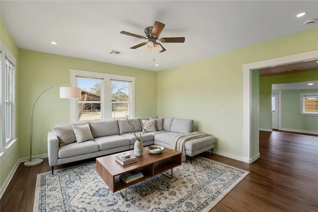 a living room with furniture and a rug