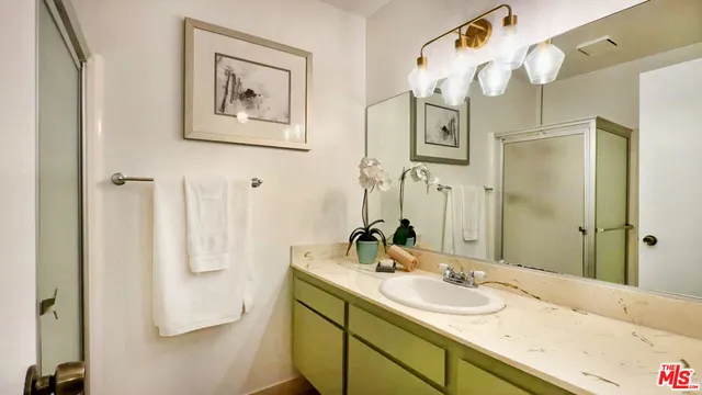 a bathroom with a sink and mirror