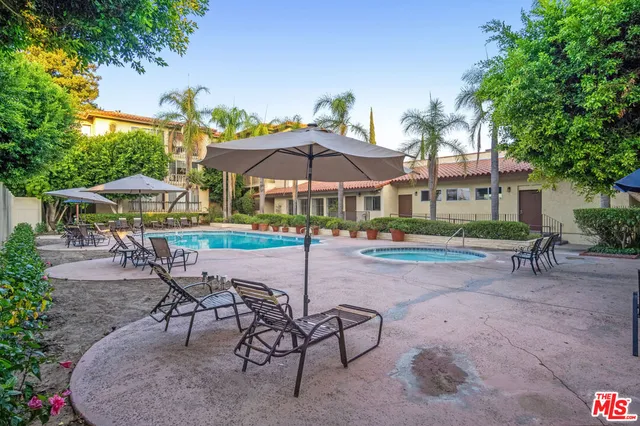 a patio with a yard table and chairs