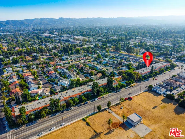 an aerial view of residential houses and city street