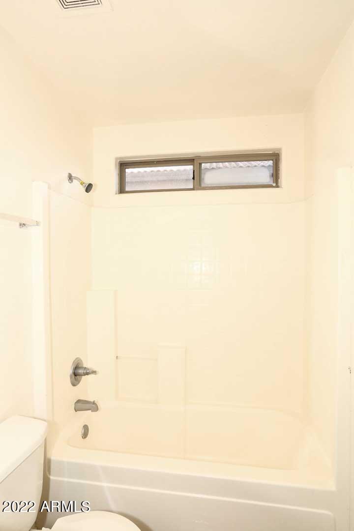 4319 West Carson Road Laveen, AZ 85339 - Photo 25 of 36 a bathroom with a shower