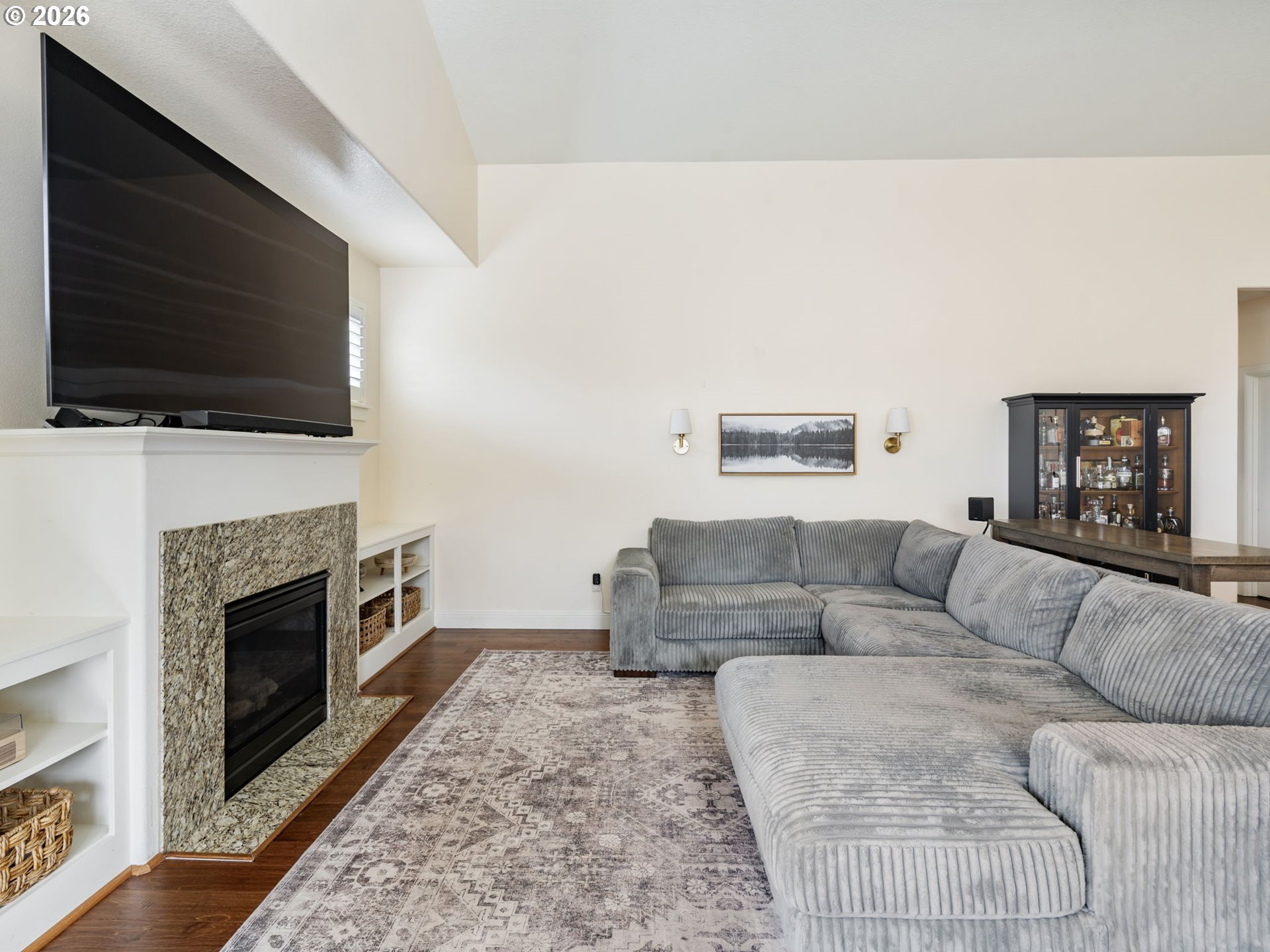 4081 Southwest Binford Avenue Gresham, OR 97080 - Photo 11 of 43 a living room with furniture a fireplace and a flat screen tv