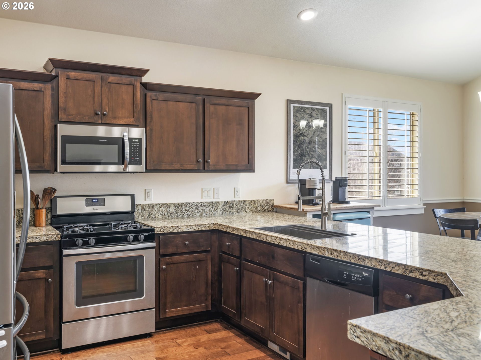 4081 Southwest Binford Avenue Gresham, OR 97080 - Photo 16 of 43 a kitchen with a sink stove and microwave