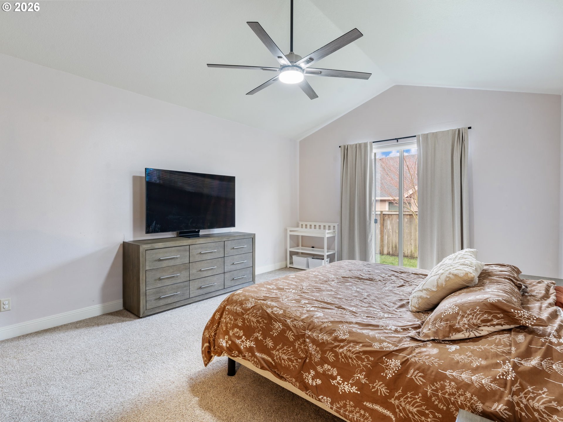4081 Southwest Binford Avenue Gresham, OR 97080 - Photo 24 of 43 a bedroom with a bed and a flat screen tv
