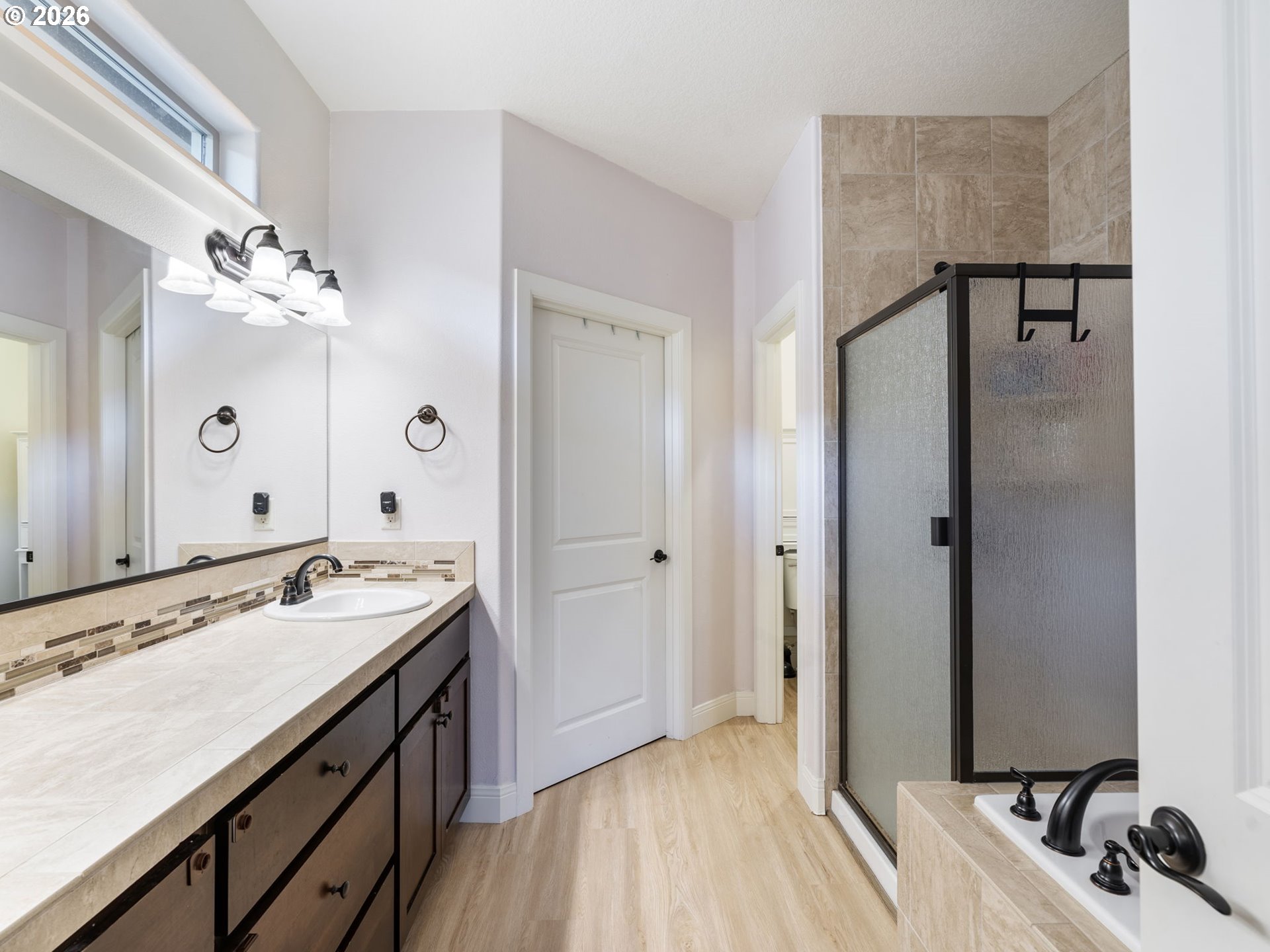 4081 Southwest Binford Avenue Gresham, OR 97080 - Photo 26 of 43 a spacious bathroom with a sink and a mirror