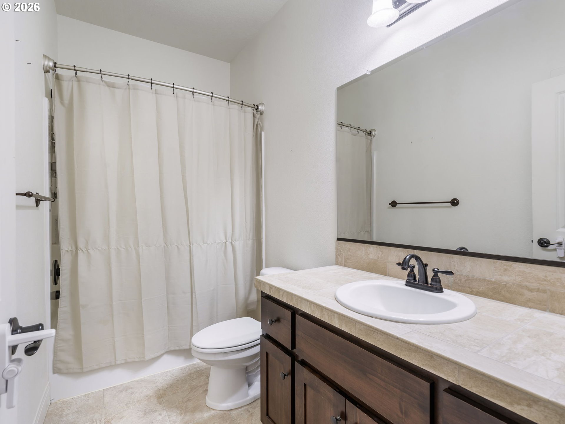 4081 Southwest Binford Avenue Gresham, OR 97080 - Photo 37 of 43 a bathroom with a granite countertop sink toilet and a mirror