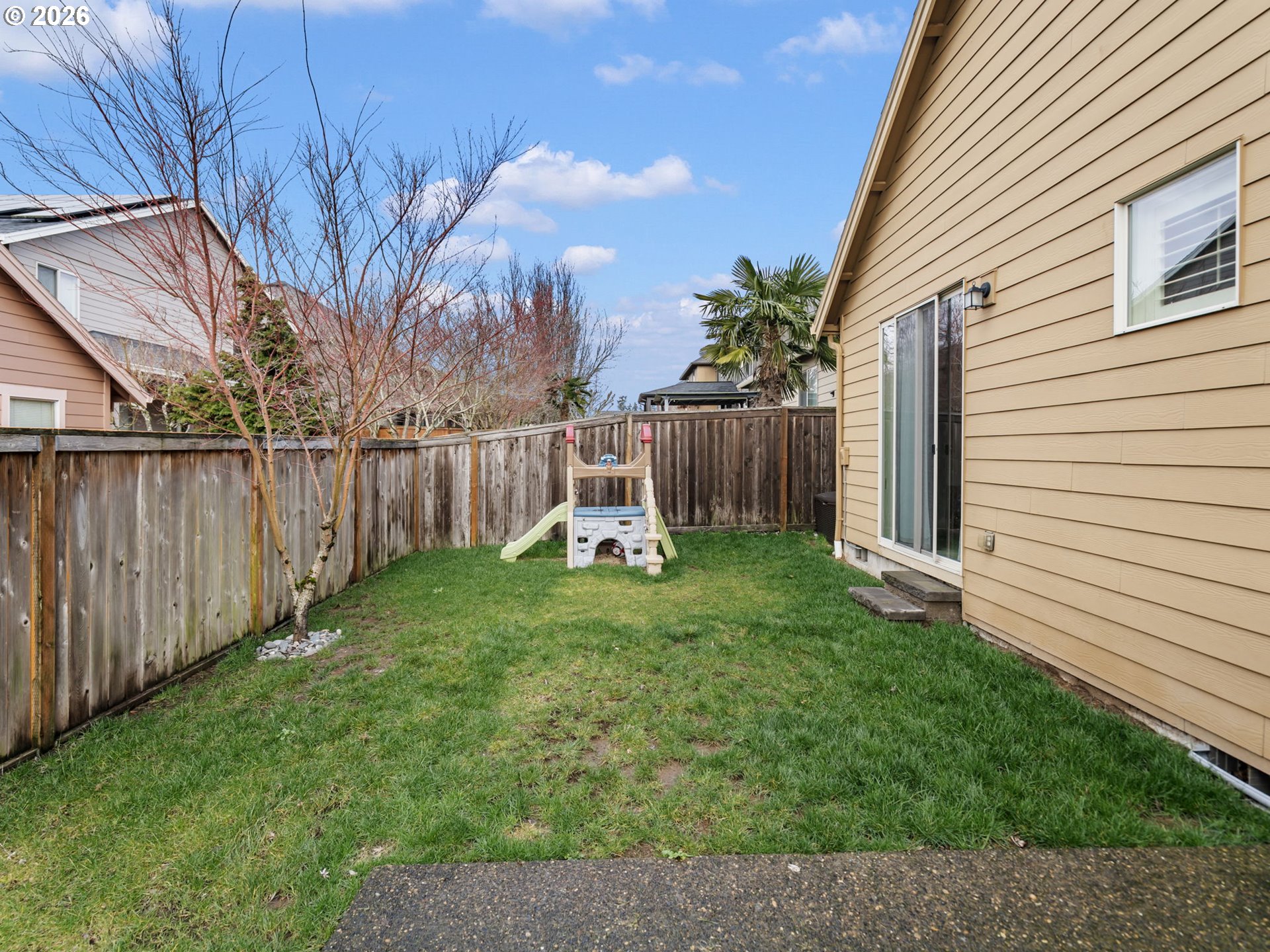 4081 Southwest Binford Avenue Gresham, OR 97080 - Photo 43 of 43 a view of a backyard with plants and wooden fence