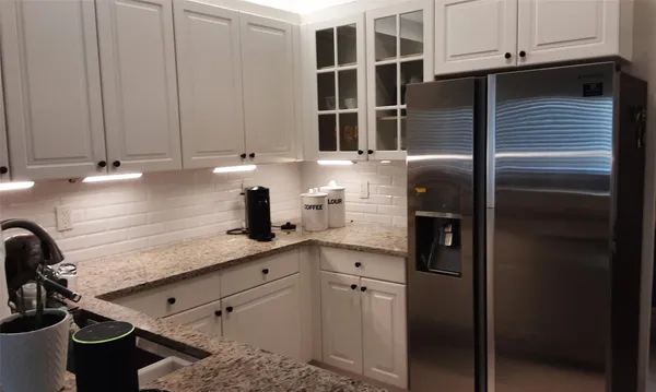 a kitchen with a sink and cabinets