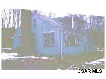 Polk Hill Road Addison, PA 15411 - Photo 1 of 1 a black and white photo of a house