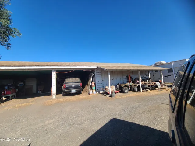 a view of a livingroom with car and bike