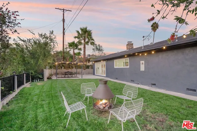 a chairs and table in a garden