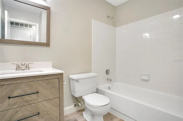 a bathroom with a sink toilet and bathtub