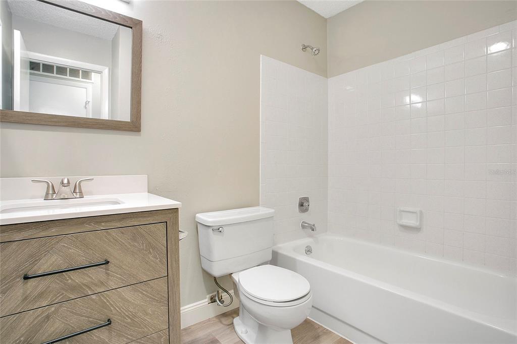 513 Fairways Lane, Unit B Ocala, FL 34472 - Photo 6 of 18 a bathroom with a sink toilet and bathtub
