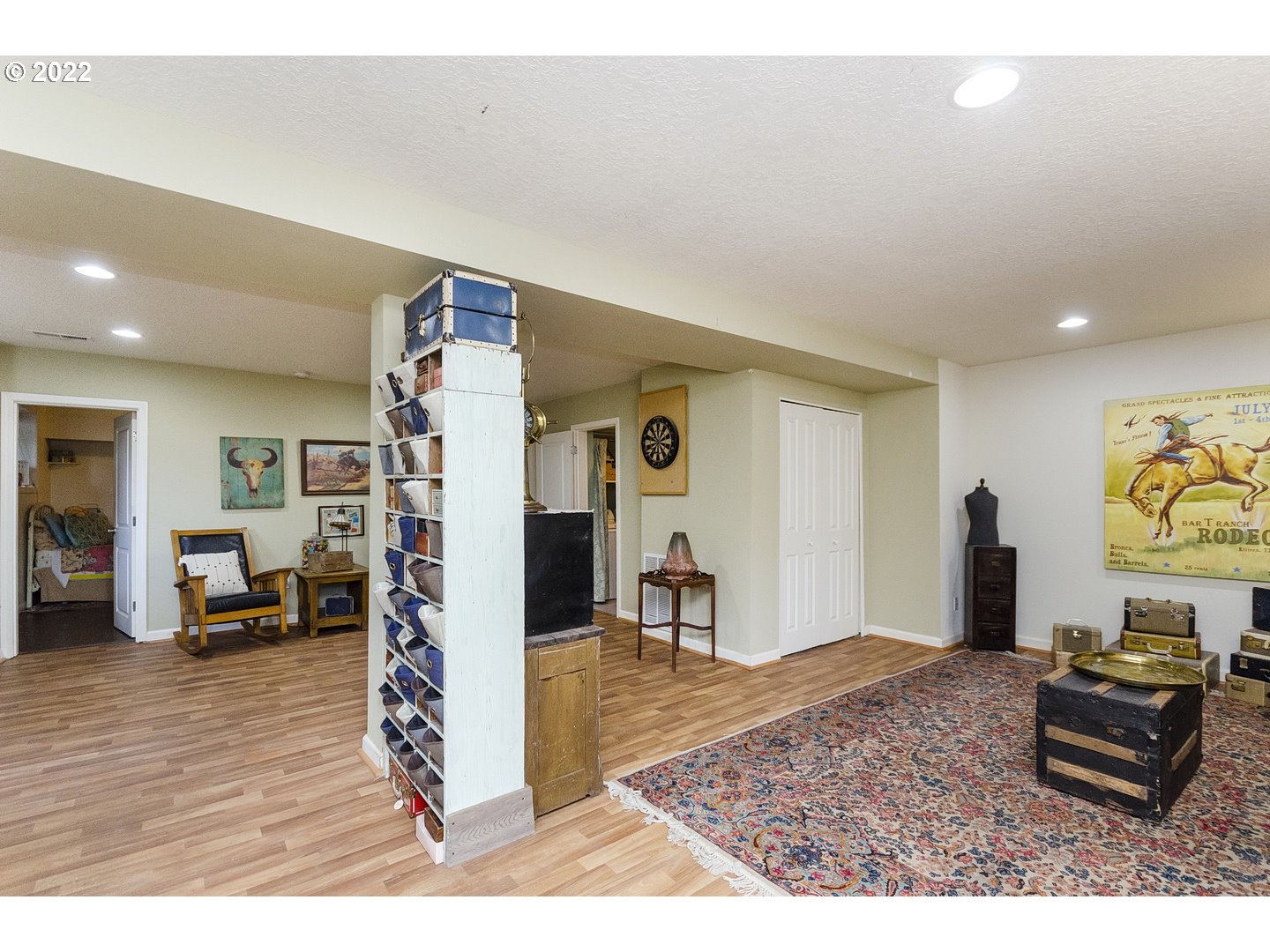 20901 Southeast Bohna Park Road Damascus, OR 97089 - Photo 18 of 32 a living room with furniture and a flat screen tv
