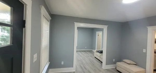 a spacious bathroom with a toilet sink and a mirror