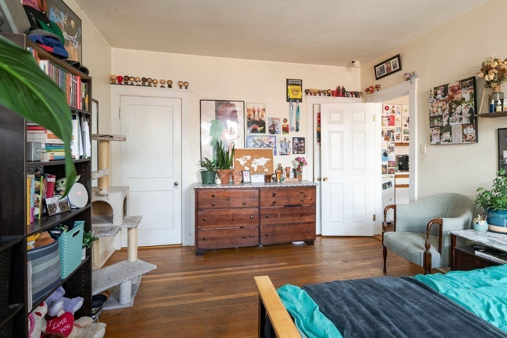 72 Strathmore Road, Unit 7A Boston, MA 02135 - Photo 12 of 16 a room with wooden floor and furniture