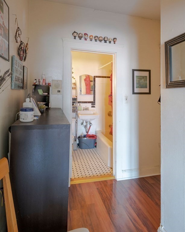 72 Strathmore Road, Unit 7A Boston, MA 02135 - Photo 2 of 16 a living room with a couch and a table