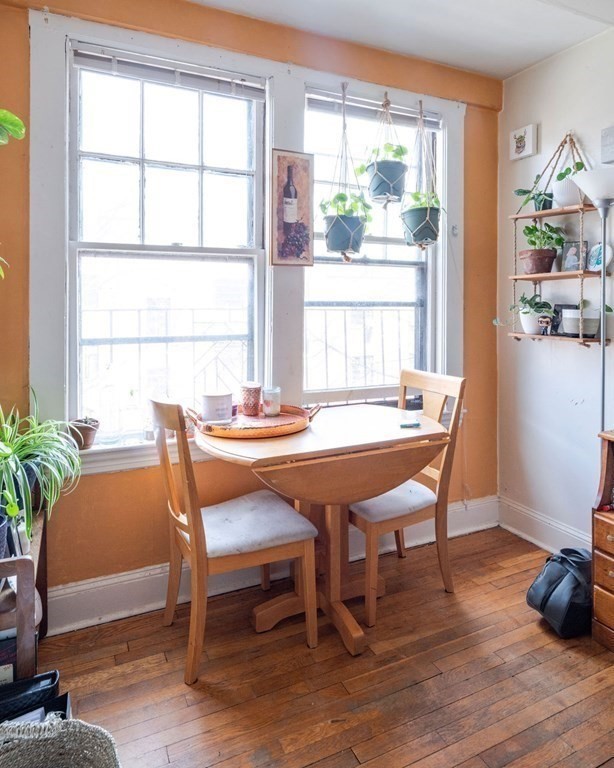 72 Strathmore Road, Unit 7A Boston, MA 02135 - Photo 4 of 16 a dining room with furniture window and wooden floor