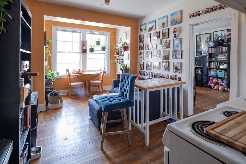 72 Strathmore Road, Unit 7A Boston, MA 02135 - Photo 5 of 16 a living room with furniture and wooden floor